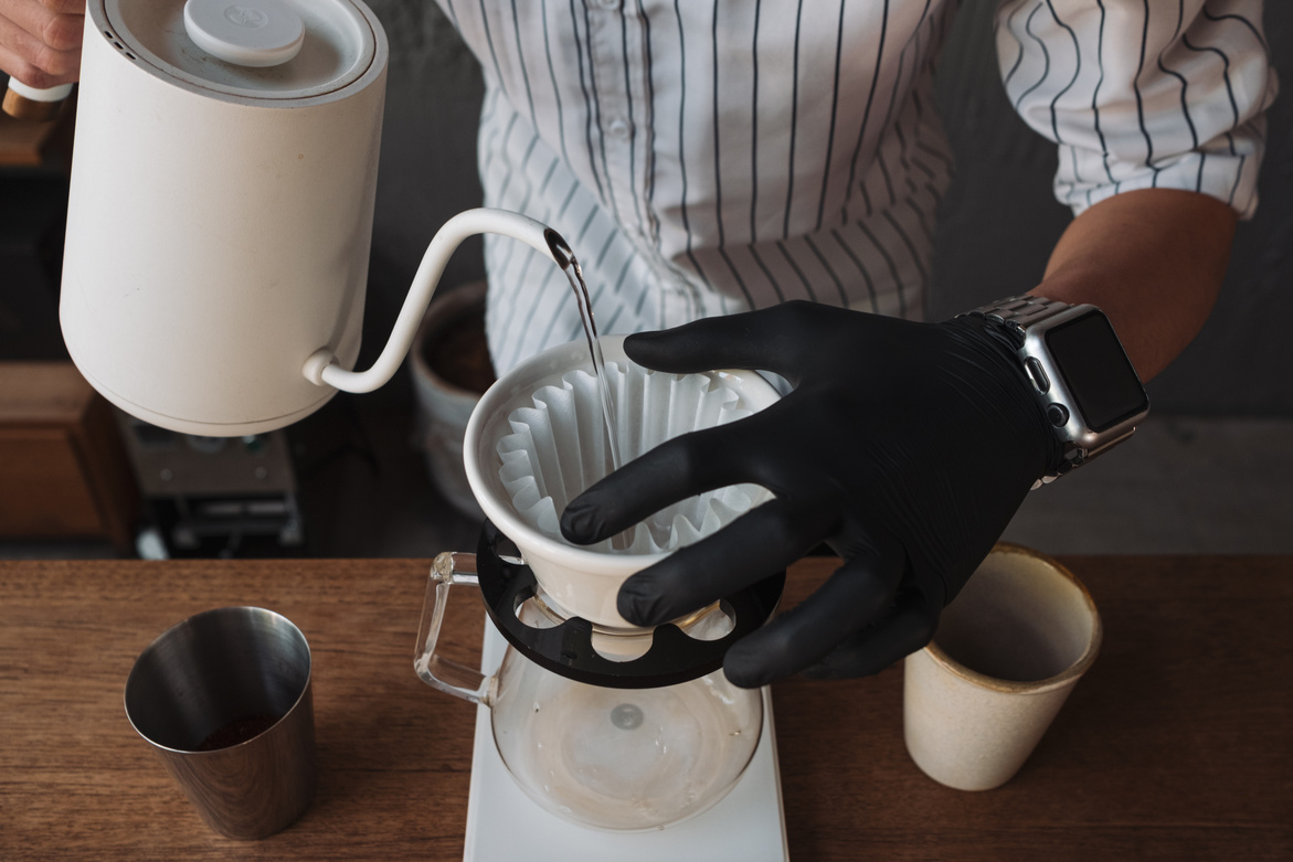 barista dripping coffee and slow coffee bar style